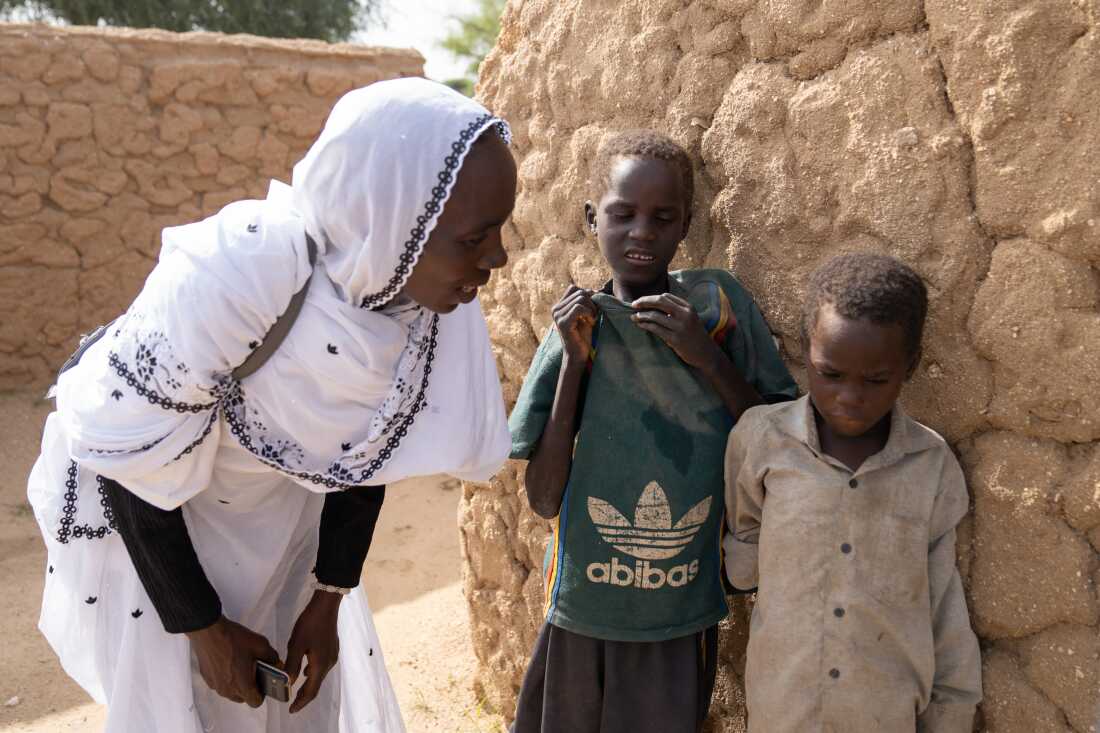 Maqboula Ahmad Adam, a Sudanese refugee who volunteers with World Vision, says she checks in on Mahamat and his brothers a few times a week. 