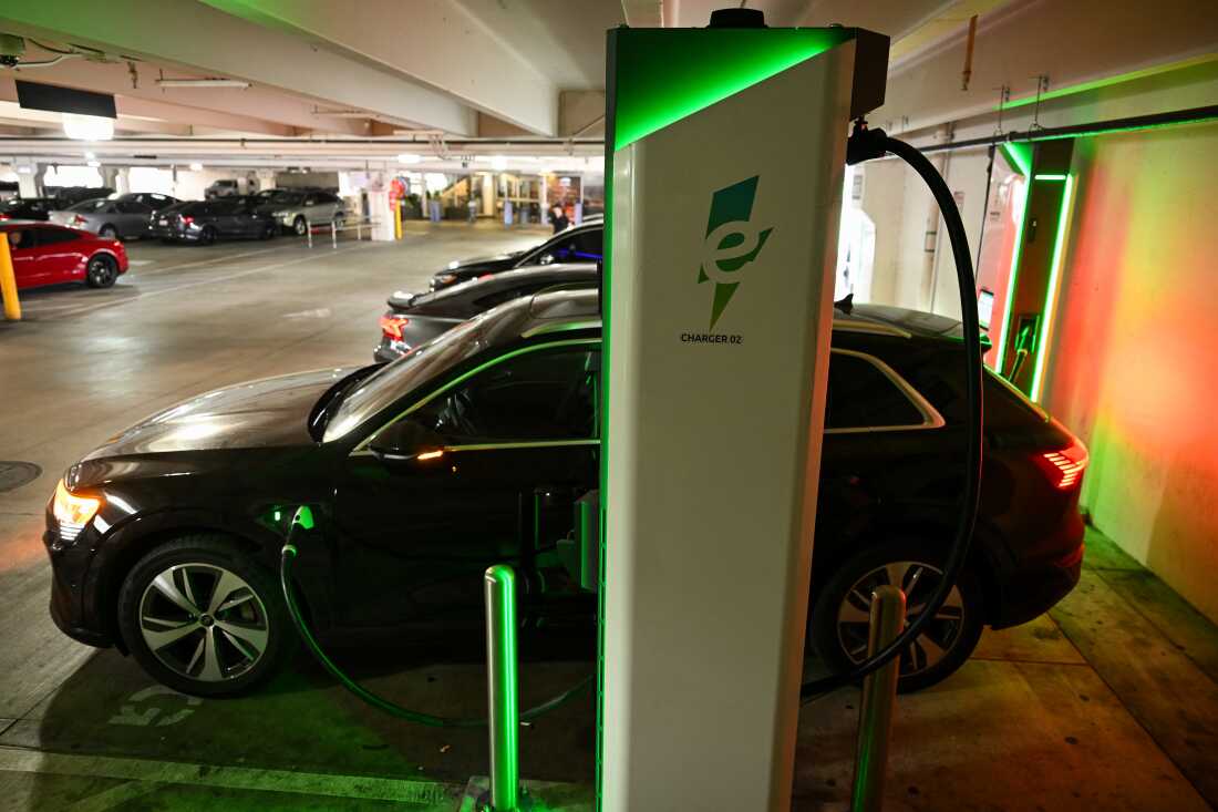 An electric vehicle charges at a public Electrify America direct current fast charger in Los Angeles on May 16.