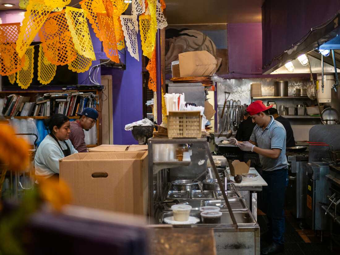 Employees at La Morada in the Bronx. Yunuen Bonaparte/NPR