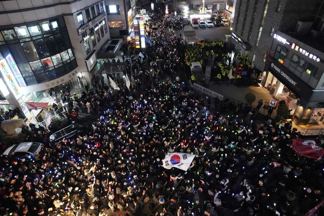 Protesters stage a rally to demand South Korean President Yoon Suk Yeol's impeachment in front of the headquarters of the governing People Power Party in Seoul, South Korea, Monday.