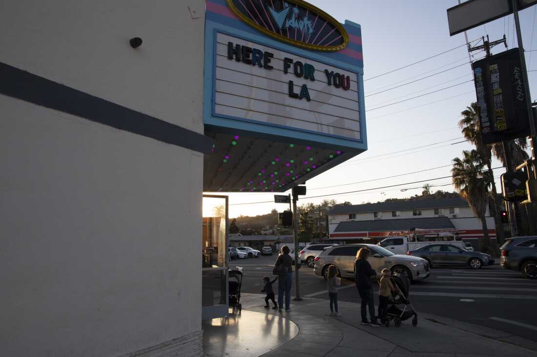 The exterior of the Vidiots theater displays a sign that reads, "Here for you LA."