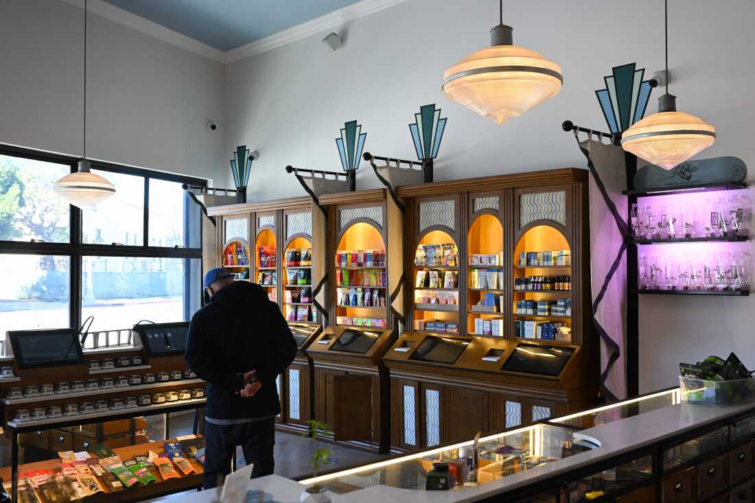 A customer browses products for sale at the Green Goddess Collective legal cannabis dispensary in the Venice neighborhood of Los Angeles, California. State officials and many cannabis experts hope licensed shops will eventually displace the booming black market industry.