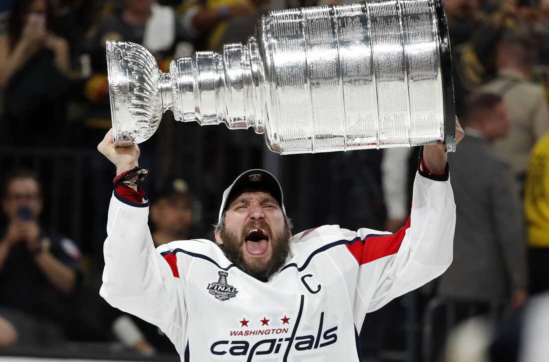Washington Capitals left wing Alex Ovechkin, of Russia, hoists the Stanley Cup after the Capitals defeated the Golden Knights in Game 5 of the NHL hockey Stanley Cup Finals Thursday, June 7, 2018, in Las Vegas. (AP Photo/John Locher)