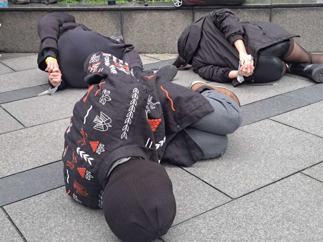 Members of the Ukrainian community in Taiwan and Taiwanese activists stage a performance drawing attention to the Ukrainian civilians killed, tortured and imprisoned as a result of Russia’s invasion to mark the three-year anniversary of Russia’s full-scale invasion of Ukraine.