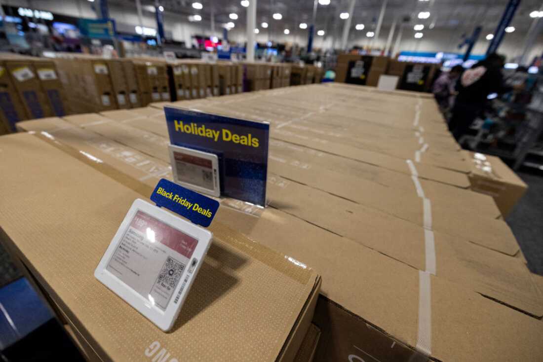 Signs displayed on a row of televisions in cardboard boxes at a Best Buy store on Black Friday in Montebello, California, November 29, 2024. The annual Black Friday shopping day has always been about finding the best deals, but this year retailers are preparing for a US consumer more zealously fixated than ever on getting value for their money. (Photo by ETIENNE LAURENT / AFP) (Photo by ETIENNE LAURENT/AFP via Getty Images)