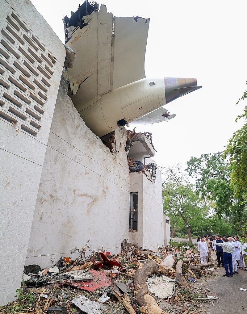 alt="Debris from Boeing 787 after Air India Flight 171 crash in residential area"