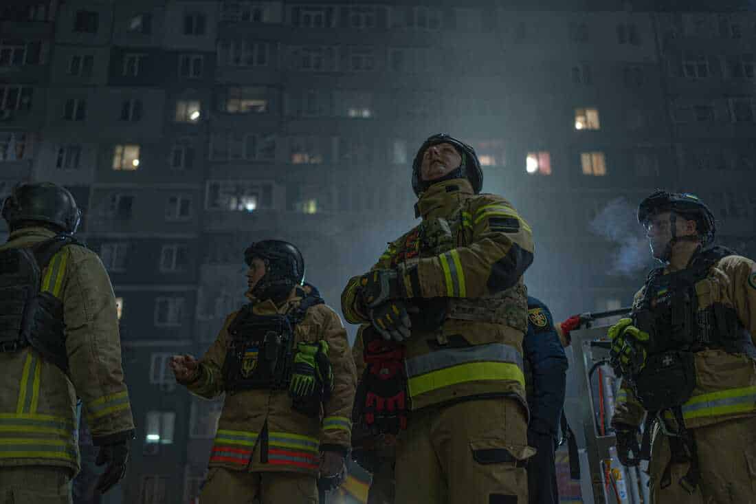 Rescue team in front of damaged residential building in Sumy just after strike of Russian kamikaze drone Shahed on Jan. 30, 2025.