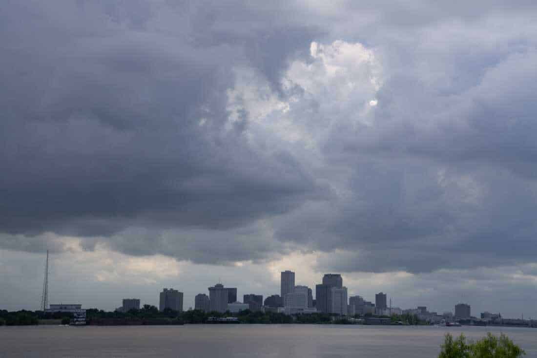 A view of New Orleans with storm clouds overhead.