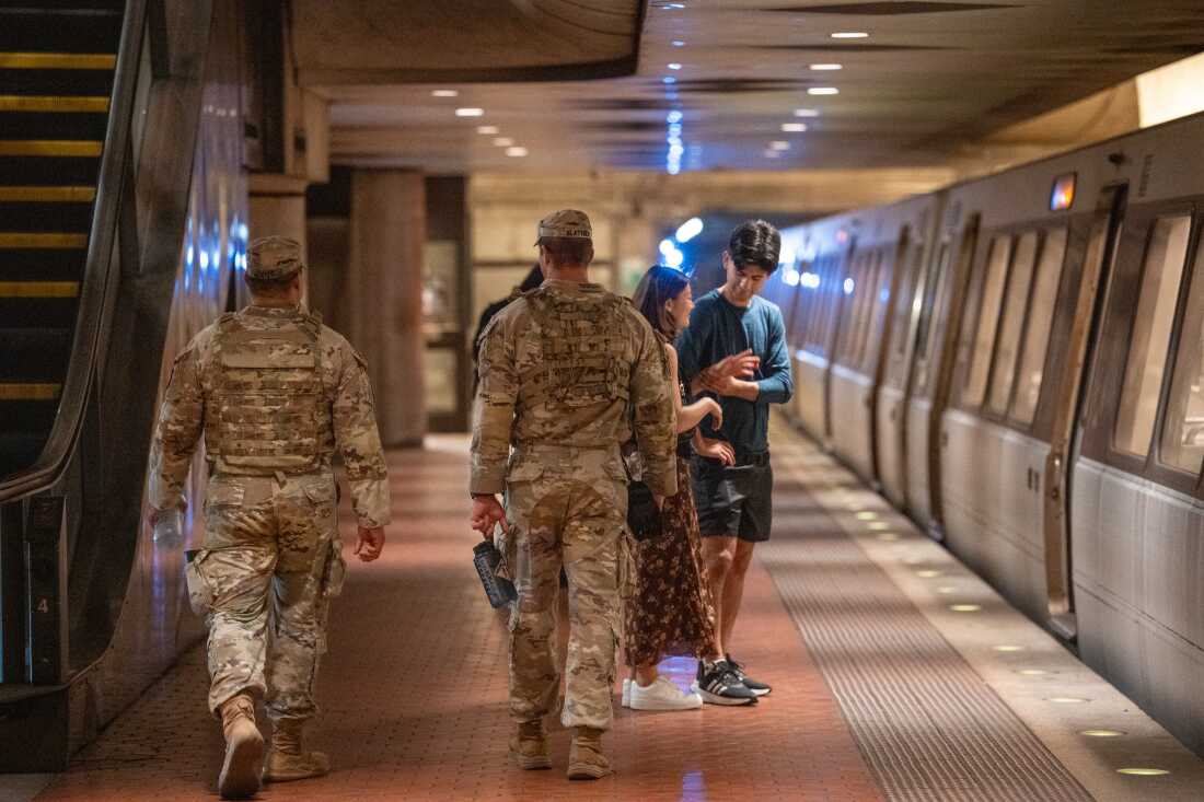 Members of the D.C. National Guard patrol the Foggy Bottom Metro station.