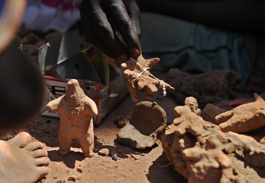 Children playing in the dirt, make clay models of soldiers brandishing rifles on February 18, 2014 at the United Nations Mission in South Sudan (UNMISS) compound in Rumbek, Lakes state, South Sudan, where at least a hundred of people from the Nuer tribe have lived since fleeing their homes two months ago for fear of attacks by members of the Dinka ethnic group. Independent for nearly three years as of mid-last December when South Sudan's fell into wide-spread, deadly ethnic violence the shortlived peace is seen to be sacrificed at the altar of a corrupt albeit fledgling government. Independent for nearly three years as of mid-last December when South Sudan fell into wide-spread, deadly ethnic violence the shortlived peace is seen to be sacrificed at the altar of a corrupt albeit fledgling government. Influenced principally by the two largest ethnic groups, Dinka and Nuer respectively, also traditionally fierce rivals -- government efforts to contain simmering intercommunal resentment, led to rifts within the ruling SPLM, according to US special envoy to Sudan and South Sudan, Donald Booth.