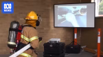 Erica CFA volunteer using virtual reality firefighting simulator inside fire station
