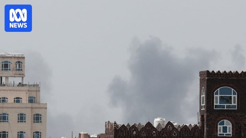 Smoke rising over Sanaa International Airport after a reported air strike on the runway