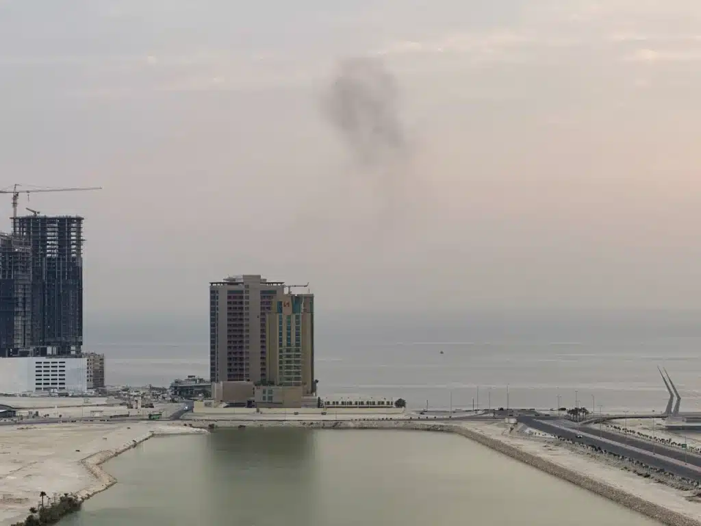 Explosions and smoke along Iran's southern coast amid reported US strikes and Iranian retaliatory attacks