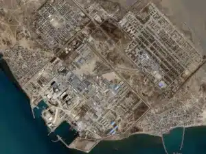 Satellite image showing apparent impact scars inside Iran's Bushehr nuclear power plant complex and nearby support facilities